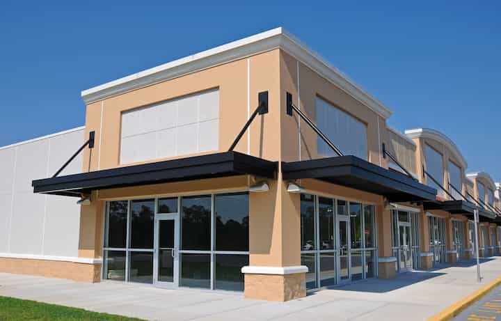 Bright red commercial awning in Durham, NC.